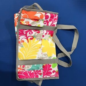 A smaller tote bag, with many pockets.